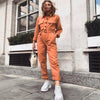 Salopette femme au style décontracté - combinaison utilitaire orange à manches longues et taille ceinturée