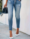 Jean skinny taille haute - un denim chic avec détails à boutons