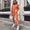 Salopette femme au style décontracté - combinaison utilitaire orange à manches longues et taille ceinturée