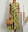 Robe maxi à imprimé floral pour femme - élégante, manches courtes avec poches pour un look décontracté au quotidien