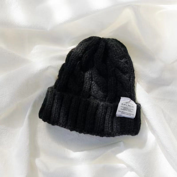 Bonnet tricoté - élégante tuque en maille torsadée pour l'hiver
