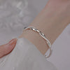 Bracelet jonc en argent torsadé pour femmes - accessory léger et élégant pour le quotidien et les soirées