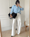 Pantalons larges pour femmes - style chic au bureau avec design asymétrique taille haute en blanc classique