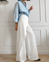 Pantalons larges pour femmes - style chic au bureau avec design asymétrique taille haute en blanc classique