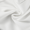 Pantalons larges pour femmes - style chic au bureau avec design asymétrique taille haute en blanc classique