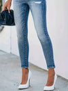 Jean skinny taille haute - un denim chic avec détails à boutons