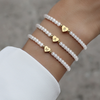 Bracelet en perles - élégant bracelet blanc pour femmes avec charme en cœur