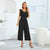 Combinaison noire avec ceinture - midi élégant pour femme
