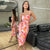 Robe midi fleurie à manches froncées en rose et orange - tenue de soirée élégante