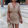 Robe scintillante - élégante robe mini à sequins avec manches chauve-souris