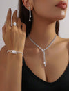 Set de bijouterie en cristal argenté 4 pièces - collier, boucles d’oreilles, bracelet et bague élégants pour femmes